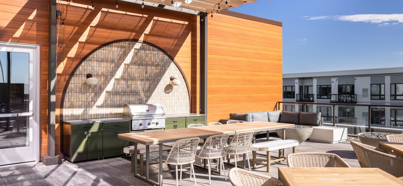 Sky Lounge with Outdoor Kitchen Ample outdoor seating with an outdoor grill